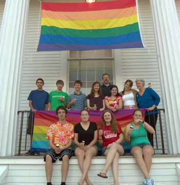 Senior youth gather in front of church